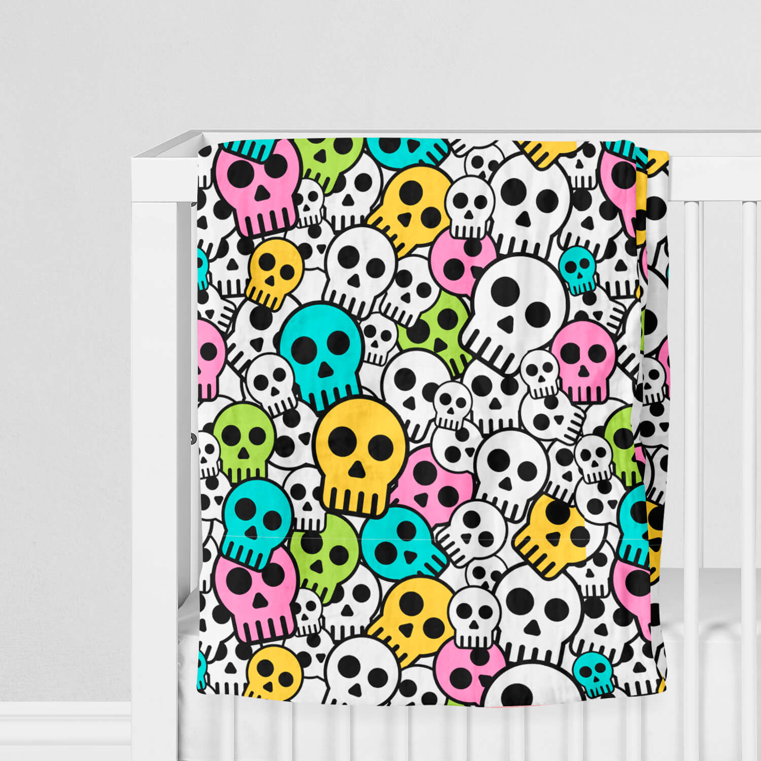 100% Muslin Cotton Swaddle Blanket with Skulls on crib
