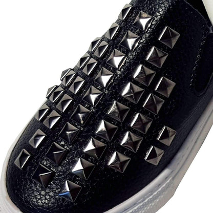 Kids black stud faux leather shoes close up detail