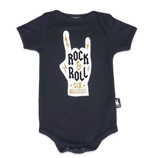 Baby onesie with white and gold rock & roll design on black fabric